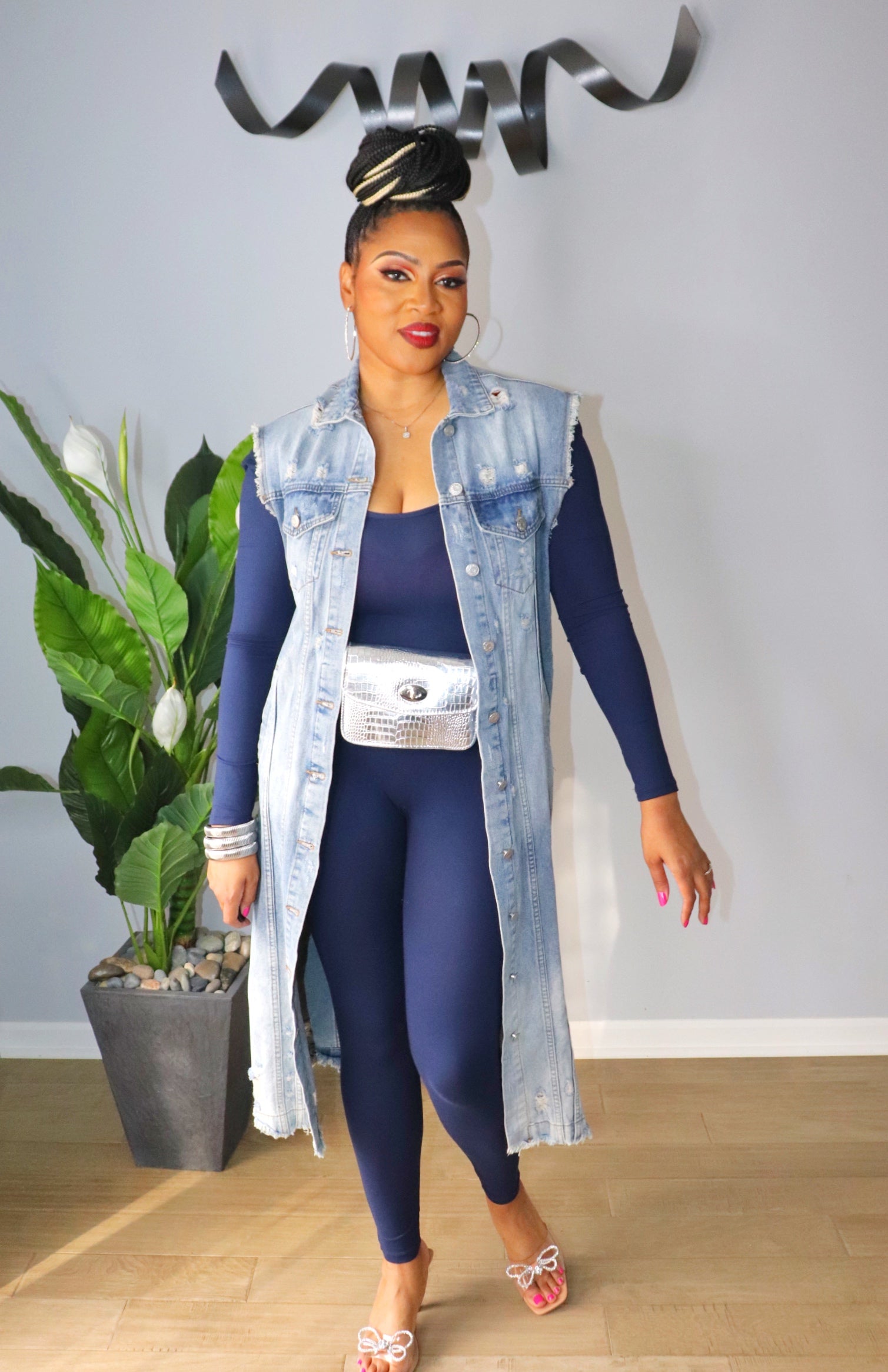 Woman styled navy scoop neck bodycon jumpsuit from Adrienne Rebecca Boutique