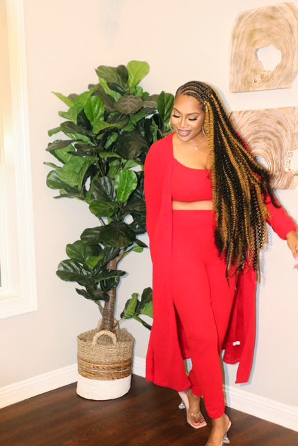 Model in red 3-piece loungewear set from Adrienne Rebecca Boutique featuring a cardigan, tank, and leggings