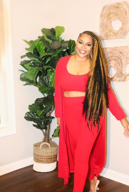 Model in red 3-piece loungewear set from Adrienne Rebecca Boutique featuring a cardigan, tank, and leggings
